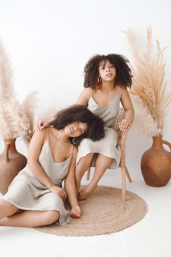 Two Afro-Haired Women in Beige Dress